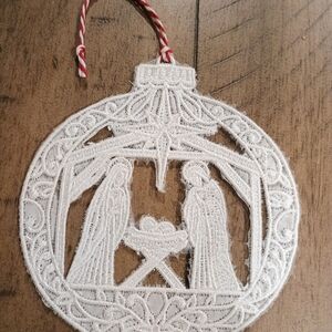 Intricate White Lace Nativity Ornament